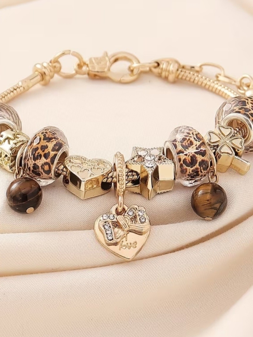 Gold-Tone Heart Charm Bracelet with Leopard Bead Accents
